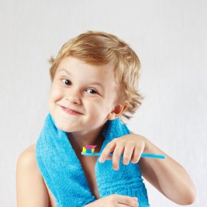 kid with a toothbrush